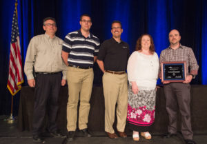 Accepting the American Gas Association’s Achievement in Safety Award on behalf of Eastern Shore Natural Gas Company, from left: Bill Hermstedt, Operations Project Coordinator; Nick Bishop, Project Engineer; Mark Parker, Engineer Manager; Marianne Coker, Gas Control Manager; and Solomon McCloskey, Senior Manager, Gas Pipeline Operations.